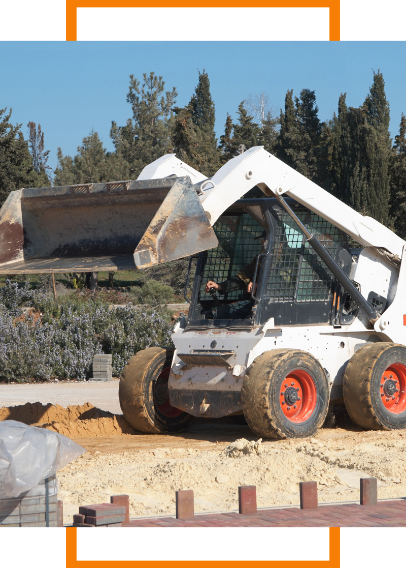 tractor clearing a lot